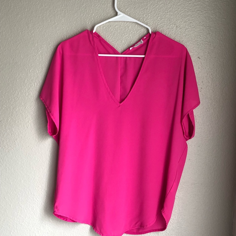 Hot pink blouse.